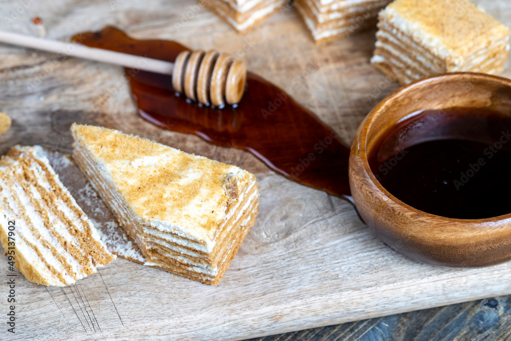 cake made of thin honey cakes and a thin creamy layer cake made of thin honey cakes and a thin creamy layer