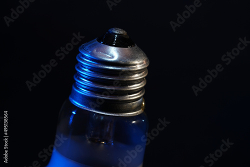 Lightbulb, halogen, incandescent lamp are reserve lamps for motor vehicles in 12 volt operation photographed in the studio photo