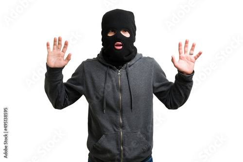 Surprised masked criminal getting arrested