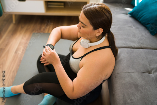 Using a fitness tracker on her smartwatch