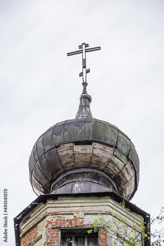 the dome of an abandoned church with a cross the dome of an abandoned church with a cross
