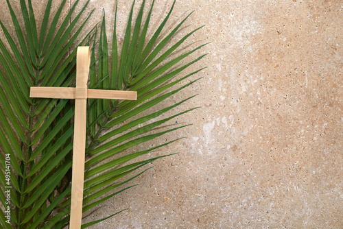 Palm cross and palm leaves. Palm sunday and easter day concept. photo