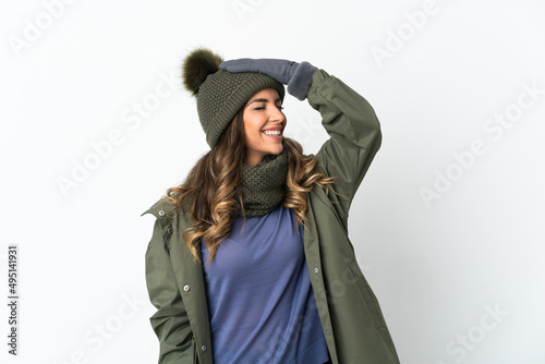 Young girl with winter hat isolated on white background has realized something and intending the solution