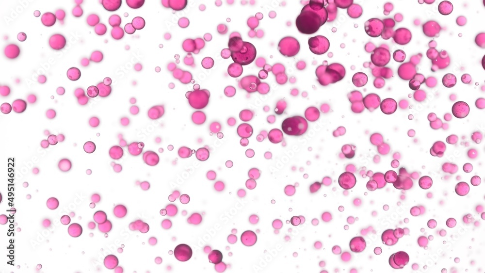 Rose oil is poured into the water creating a lot of different sized clear pink bubbles on white background | Abstract body care cosmetics with rose oil formulation concept