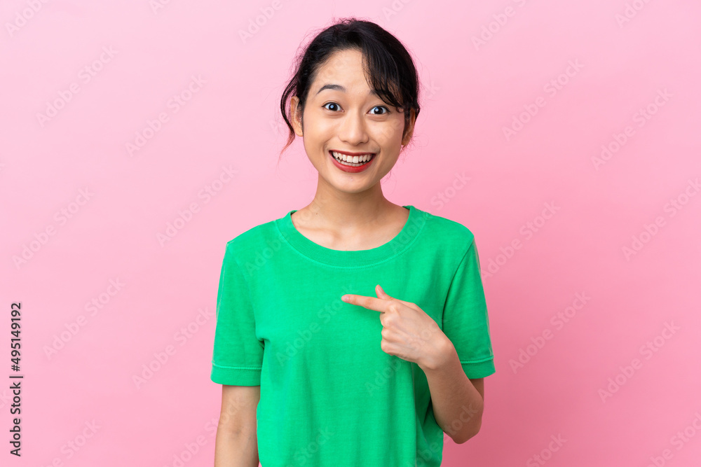 Young Vietnamese woman isolated on pink background with surprise facial expression Young Vietnamese woman isolated on pink background with surprise facial expression