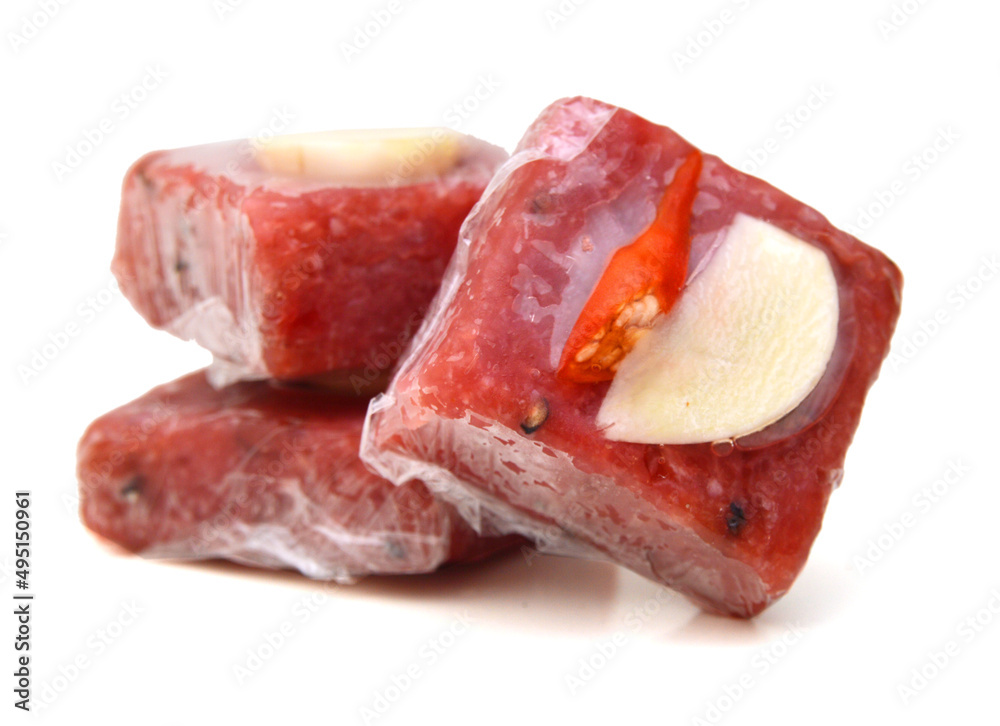 Sour pork : venamese northeastern style food which mixed pork rice garlic sugar and salt in banana leaf package.