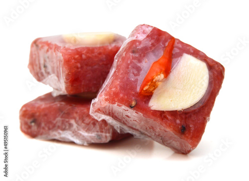 Sour pork : venamese northeastern style food which mixed pork rice garlic sugar and salt in banana leaf package.