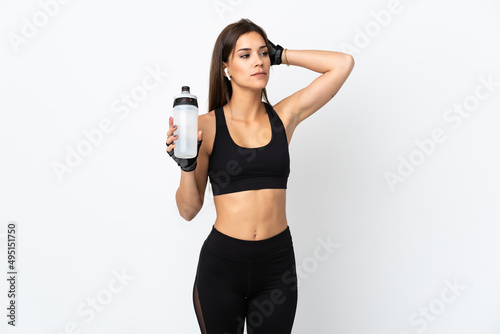 Young sport woman isolated on white background with sports water bottle