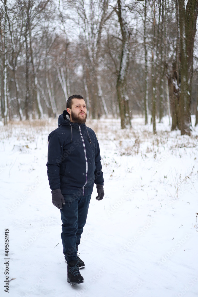 a man with beard in winter outdoors a man with beard in winter outdoors