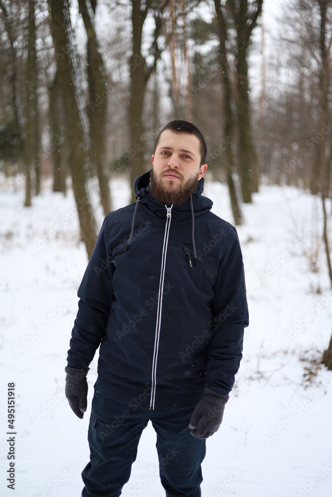 a man with beard in winter outdoors a man with beard in winter outdoors