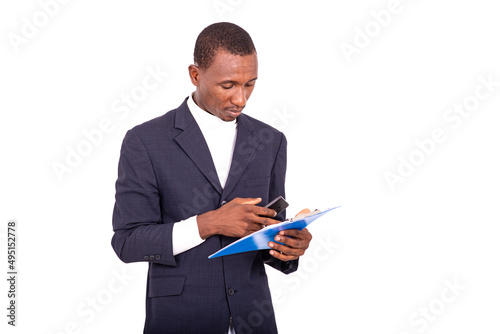 portrait of a handsome businessman with notepad and cellphone.