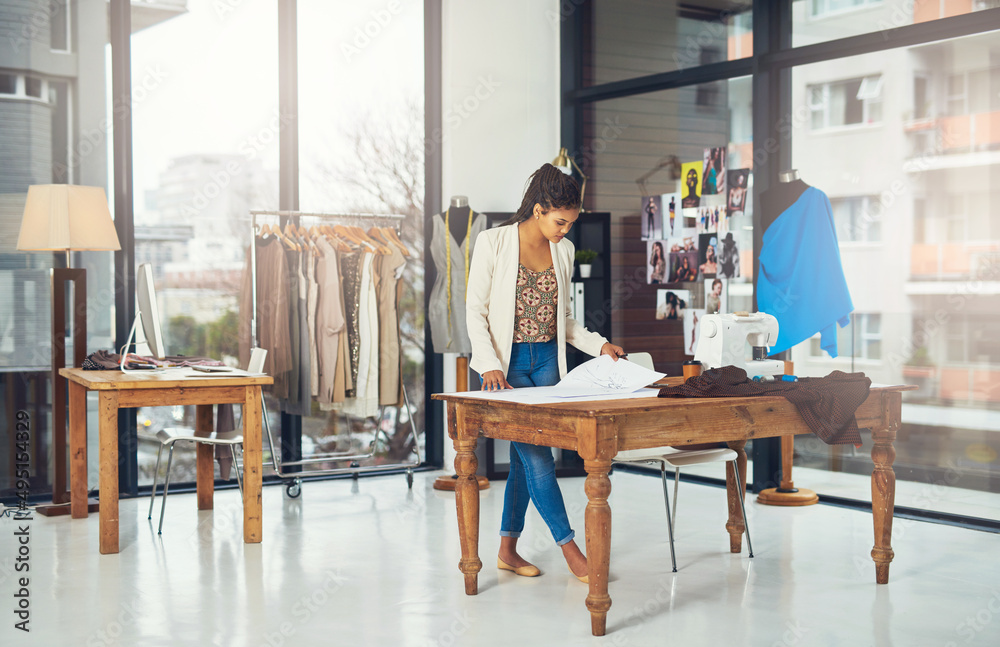 Fashion continues to be viable for me. Shot of a successful young fashion designer working on her latest creation. Fashion continues to be viable for me. Shot of a successful young fashion designer working on her latest creation.