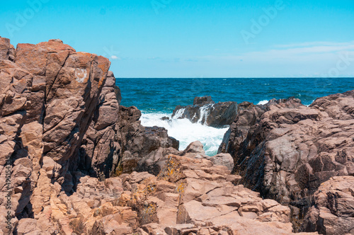 Sea surf day landscape. Sea waves with white foam breaks on stones. Sozopol. Bulgaria