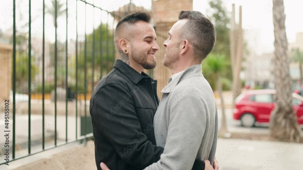 Young couple smiling confident hugging each other standing at street Young couple smiling confident hugging each other standing at street