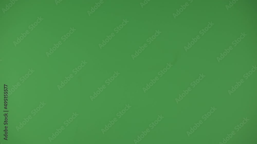 Transition. Black paper is on fire on a green background.