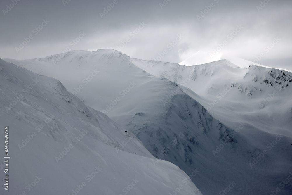Cloudy winter landscape in the Transylvanian Alps - Fagaras Mountains, Romania, Europe