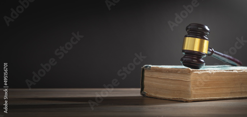 Judge gavel and book on the wooden table.