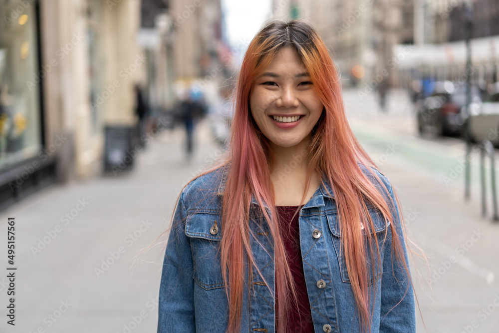 Young Asian woman with pink hair smile happy face portrait Young Asian woman with pink hair smile happy face portrait