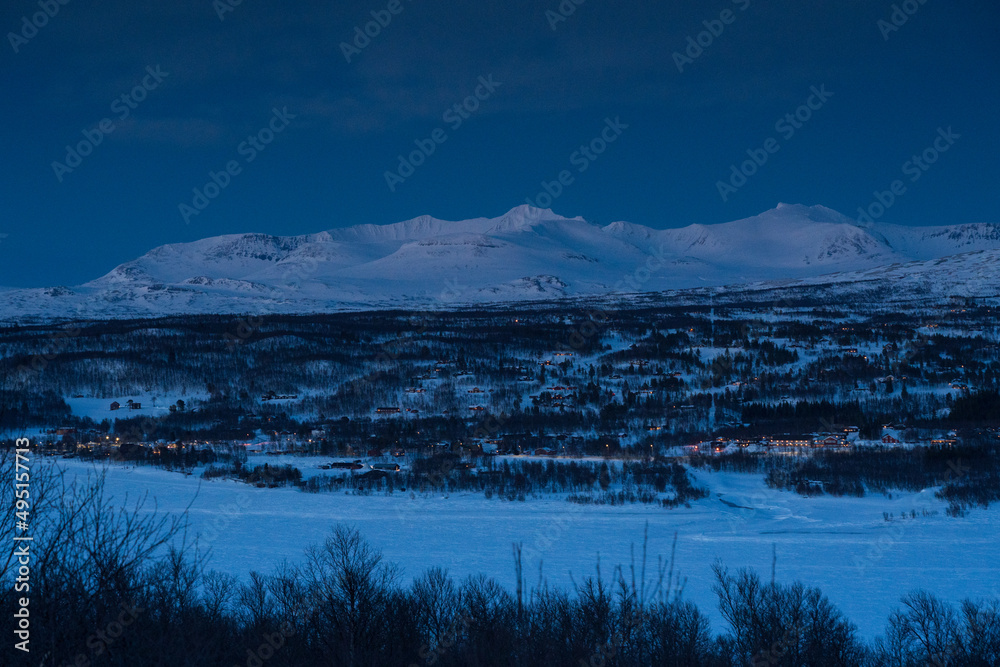 Blue hour over snow covered mountains