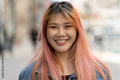 Obraz na plátne Young Asian woman with pink hair smile happy face portrait