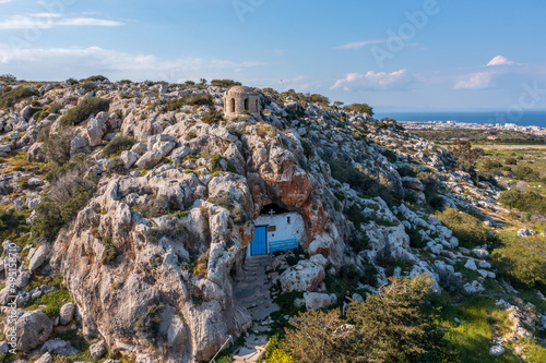 Christian orthodox cave church. Agioi Saranta holy chapel Protaras Cyprus from drone view photo