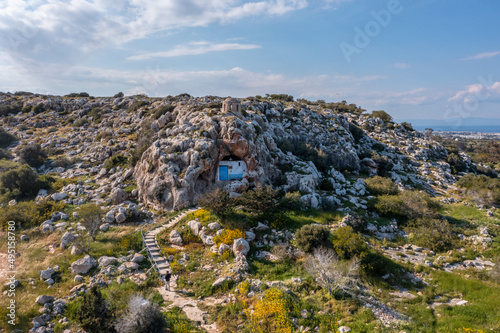 Christian orthodox cave church. Agioi Saranta holy chapel Protaras Cyprus from drone view photo