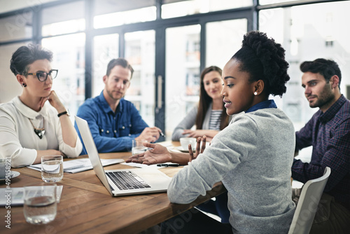 Sharing ideas and feedback. Cropped shot of a group of businesspeople meeting in the boardroom.