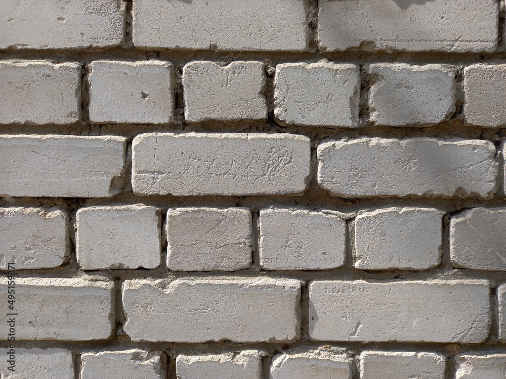 Obraz premium Brick wall made of white silicate bricks.