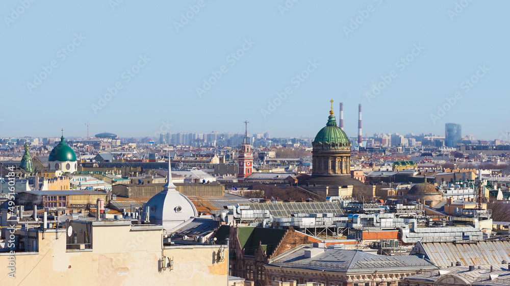 Top view of the historic city center of St. Petersburg, Russia. Cityscape with roofs of buildings and Kazan Cathedral in sunlight day. Landmarks of Saint Petersburg, Russia
