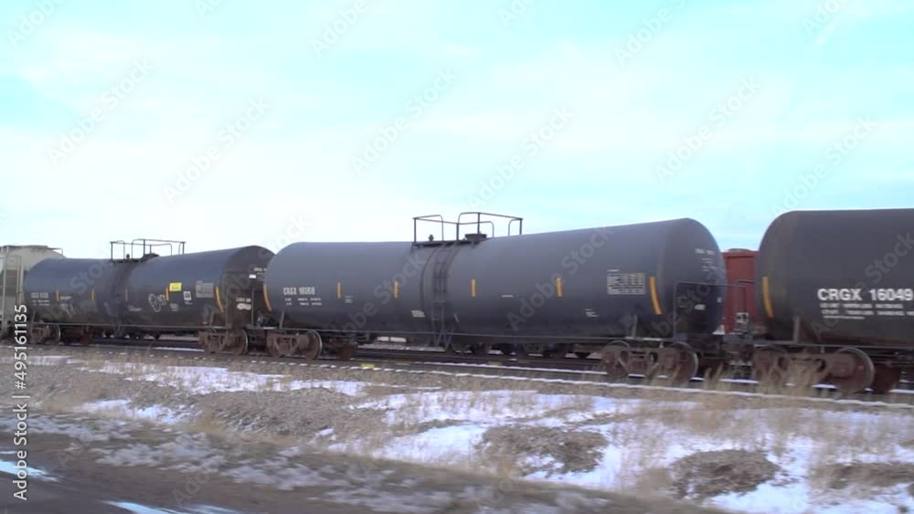 Rail transport of oil tanks. Freight train oil tankers. Refinery oil ...