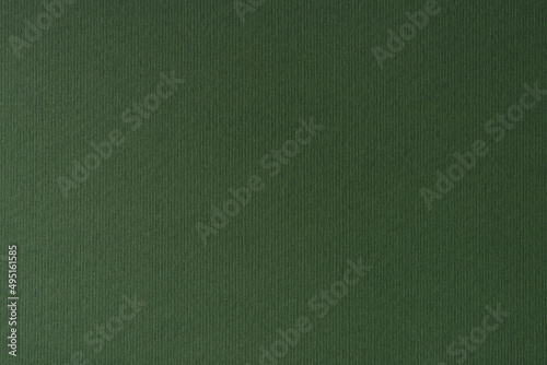 Dark green paper texture background. Close-up of drawing and fine art paper. photo