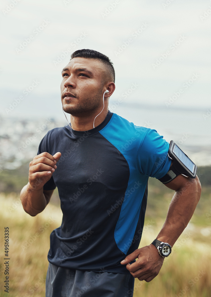 Getting fitter one step at a time. Cropped shot of a young man running outdoors.