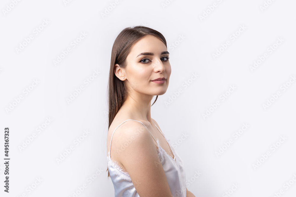 Beautiful smiling woman with clean skin, natural make-up and white teeth on a gray background Beautiful smiling woman with clean skin, natural make-up and white teeth on a gray background