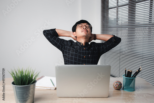Businessman Stretching His Arms on my desk in pain