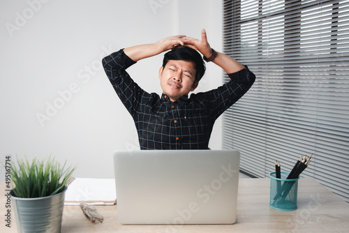 Businessman Stretching His Arms on my desk in pain