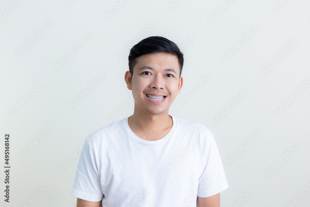 Positive human facial expressions and emotions/The smiles and happy faces of Asian men presenting a white background / advertising model concept Positive human facial expressions and emotions/The smiles and happy faces of Asian men presenting a white background / advertising model concept