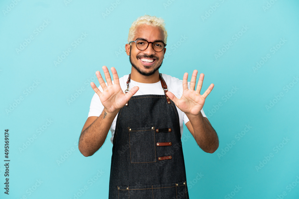 Restaurant Colombian waiter man isolated on blue background counting ten with fingers Restaurant Colombian waiter man isolated on blue background counting ten with fingers