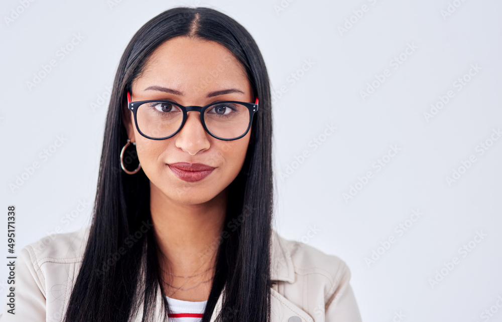 Spotting opportunity from a mile away. Studio portrait of a young woman posing against a white background.