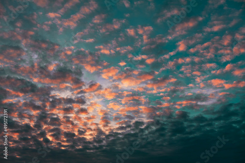 Middle level layered clouds . Altocumulus on the morning sky 