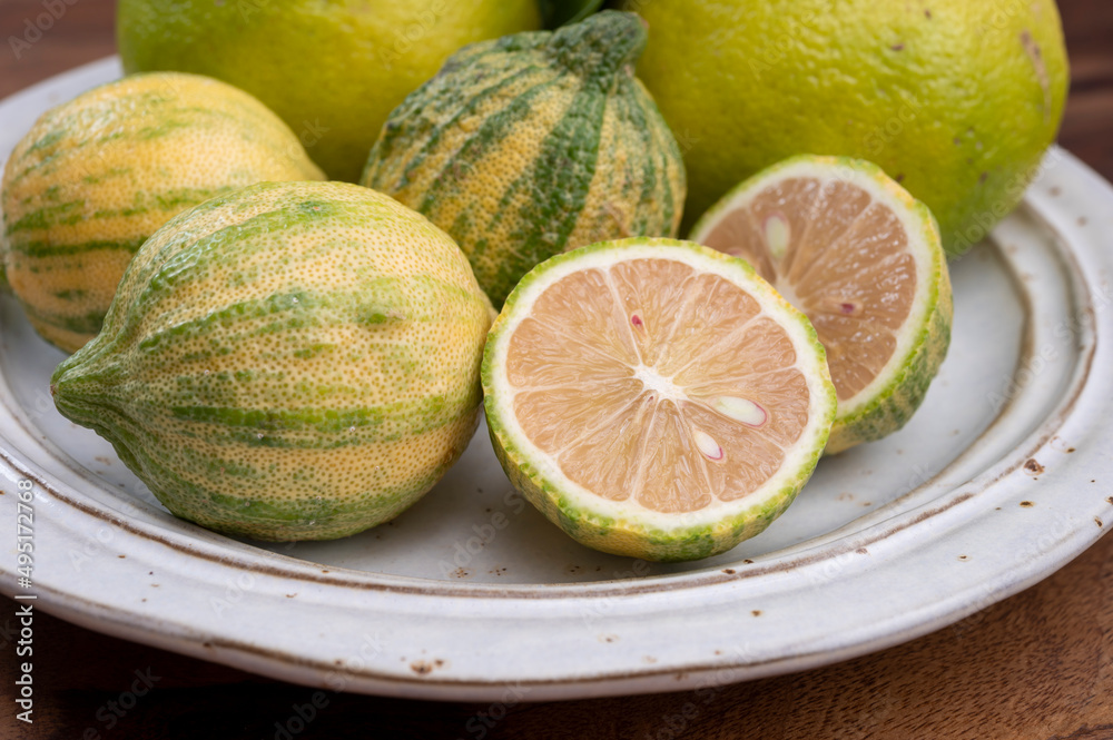 Fresh ripe bergamot citrus fruit and pink tiger lemons Fresh ripe bergamot citrus fruit and pink tiger lemons