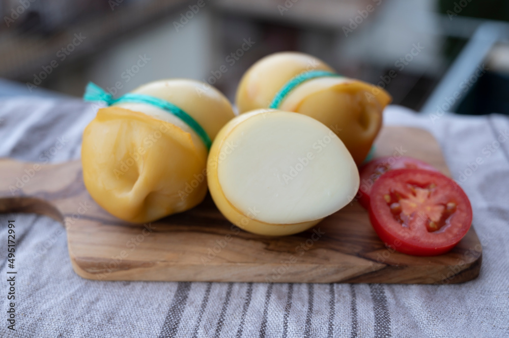 Italian cheeses collection, smoked scamorza pear shaped cheese from small cheese farm in South Italy