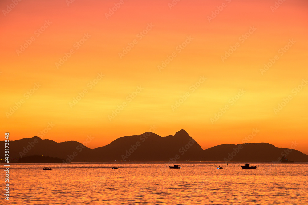 Dawn on the red beach in Urca in Rio de Janeiro.