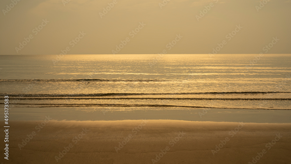 Closeup soft wave of the sea on the sandy beach