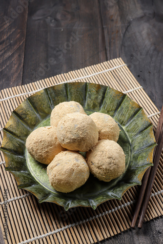 Mochi kacang or Injeolmi, Korean traditional rice cake made from the glutinous rice with peanuts filling and coated with soybean flour. photo