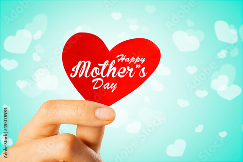 Child fingers showing happy mothers day text