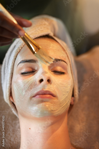 My skin deserves a treat. Shot of a young woman receiving a beauty treatment in a spa.