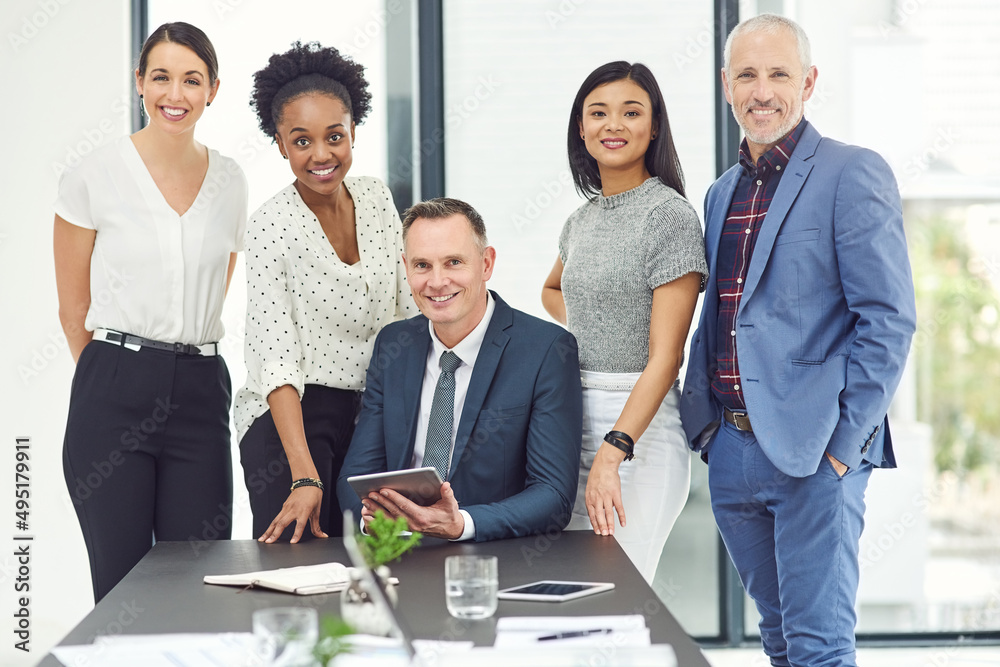 All in a days work. Portrait of a group of businesspeople working together in a modern office. All in a days work. Portrait of a group of businesspeople working together in a modern office.