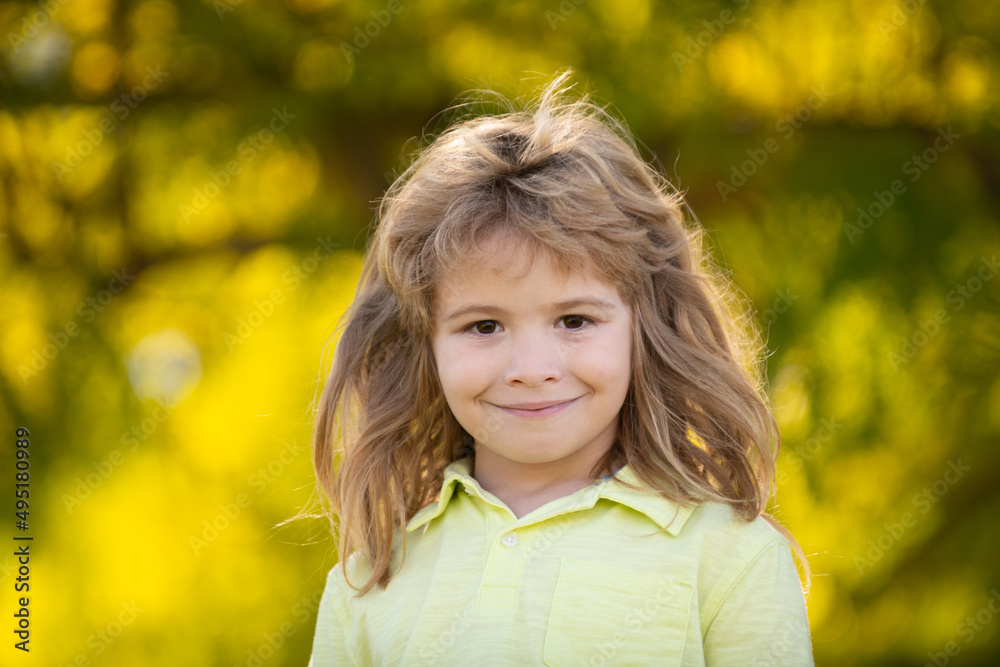 Kids portrait. Closeup face of cute smiling spring child. Kid emotions concept. Portrait of young laughing boy outdoor. Kids portrait. Closeup face of cute smiling spring child. Kid emotions concept. Portrait of young laughing boy outdoor.