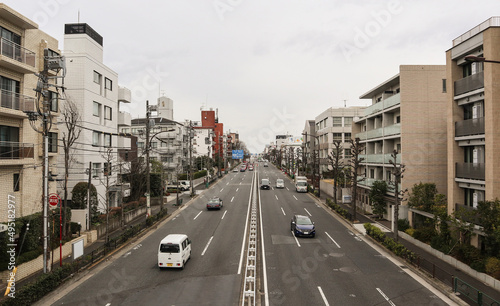 A view of a 3 lane road in Tokyo, Japan.