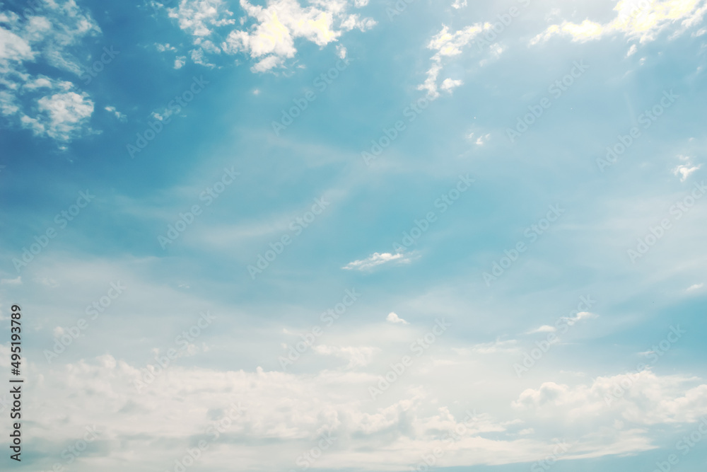 Obraz premium Blue sky, white clouds with yellow spots